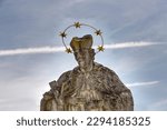 Small photo of Sonntagberg, Lower Austria, Austria - 04 22 2023: Detail of the head of the figure of Saint John of Nepomuk with the five-pointed aureole