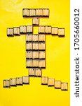 Small photo of Lots of Matchsticks Box Are Arranged In Yellow Background In Such A Way That It Looks Like Matchstick Men. Total 35 Matchstick Box Are Used To Make This.