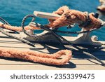 Small photo of Cleats Cleat Nautical Rope Tied Lose-Up at a Marina Harbour Pier Dock