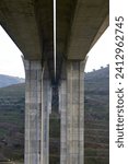Small photo of Bottom view of a reinforced concrete viaduct with two independent carriageways. A25 motorway in Portugal.