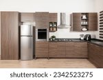 a modern design Modular Kitchen cabinet, stainless steel refrigerator with drawers and brown melamine cabinets
