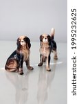 Small photo of vintage kitschy dog figurines puppy dog eyes