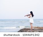Young Asian Woman Playing...