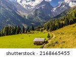 A hut in a mountain valley. Mountain hut. Hut in mountain valley. Mountain landscape