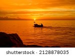Boat At Sea At Sunset. Sunset...