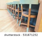 Row Of Wooden Chairs  With A...