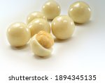 A solid chocolate ball contains some or all of the following components: cocoa solids, cocoa butter, sugar, and milk