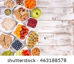 Healthy snacks on wooden table with copy space, top view