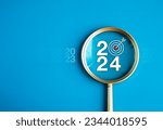 Happy new year 2024 with business concept banner. The big white 2024 year number with Target icon inside the golden magnifying glass on light blue background. Planning for goal and success concepts.