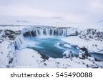 Beautiful winter Godafoss waterfall in Iceland, covered in snow