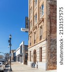 Small photo of GASTONIA, NC, USA-3 MARCH 2022: Front diagonal view of the Esquire Hotel, and Barrister's building, formerly known as the Lawyers' building, on Main Ave.