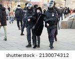 Small photo of Moscow, Russia - 2022.02.27 - police officers detain a woman on Pushkin Square at rally against special military operation