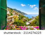 Small photo of Mountain, city and sea view through an open window with shutters of the city of Positano on the Amalfi Coast of Southern Italy during summer.
