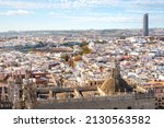 Small photo of City view from the Giralda Tower of the Great Seville Cathedral of the Plaza de toros de la Real Maestranza Bullring and Sevilla or Pelli Tower in Seville, Spain.