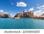 Small photo of Muscat, Oman - November 17 2022: View of the Al-Jalali Fort, or Ash Sharqiya Fort, in the harbor of Old Muscat, Oman.