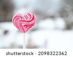 Heart shaped pink lollipop....