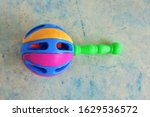 Small photo of child rattle box on the abstract background