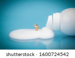 miniature man bathing in... | Shutterstock . vector #1600724542