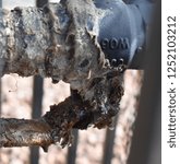 Small photo of corroded pipe up close