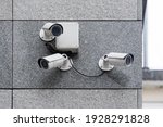 Security cameras on modern building. Professional surveillance camera. CCTV on the wall with LED IR lights. Security system, technology concept. Video equipment for safety system area control outdoor