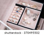 Jewelry box with white gold and silver rings, earrings and pendants with pearls. Collection of luxury jewelry