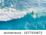 Surfer At The Top Of The Wave...