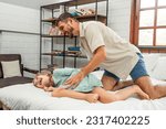 Small photo of Caucasian father spend leisure time with baby gir in bedroom at house. Happy family, Loving parent dad ticklish and playing with young kid daughter on bed at home. Parenting relationship concept