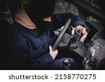 A Car Thief In A Mask Excluding ...