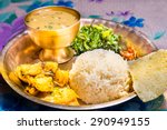 Dal Bhat, traditional Nepali meal platter with rice, lentils soup, vegetables, poppadum and spices.