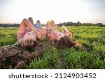 Two Girls Laying On The Grass...
