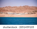 The coastline of the Red Sea and the mountains in the background. Egypt, the Sinai Peninsula, Dahab.