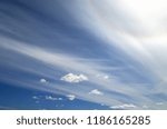 Small photo of A blue sky, with ribbon-like clouds and the solar corona
