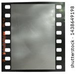 Small photo of 35mm film snip with scratched empty film cell