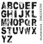 Small photo of macro photo of real black lino ink abc letters, linocutting paint roller texture on white background. alphabet imprints for your social media font collage.