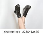 Crossed woman legs in black...
