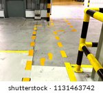 Small photo of Walkway signs and footsteps are painted yellow on the floor and laid down yellow lines in the factory.