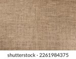 Small photo of Jute hessian sackcloth canvas sack cloth woven texture pattern background in yellow beige cream brown color
