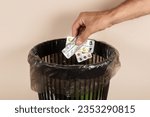 Small photo of Throw the pills in the bin, pills in hand in front of the bin.