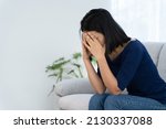 Small photo of Depression and mental illness. Asian woman disappointed, sad after receiving bad news. Stressed girl confused with unhappy problems, arguing with boyfriend, cry and worry about unexpected pregnancy.