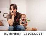 Small photo of The child is screaming, hysterical. A tired dad doesn't want to hear the baby. The parent is irritated, tired, wants to take a break from his daughter. children's hysteria.