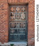 Small photo of Old wood door typical in Castilla La Mancha Don Quixote's land