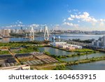 The Iconic Landmark Cross-sea Bridge (Century Bridge) and Surrounding Architecture, in the Marina Bay Area of the Capital City of Haikou, Hainan Province, China. Urban Landscape.