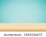 empty wood table top on blue... | Shutterstock .eps vector #1343156672