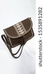 Small photo of Brown imitation leather bag for women with white details in Moroccan style