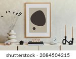 Stylish and modern beige living room interior composition with mock up poster frame, beige wooden sideboard and boho inspired accessories. Template.