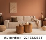 Aesthetic composition of living room interior with mock up poster frame, modular sofa, wooden coffee table, vase with dried flowers, pillows, armchair and personal accessories. Home decor. Template. 