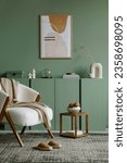 Small photo of Modern living room interior composition with mock up poster frame, frotte armchair, wooden commode and modern home accessories. Eucalyptus wall. Template. Copy space. Real photo.