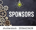 Sponsorship - word from wooden blocks with letters, financially supporting sponsoring fundraising concept, top view on grey background