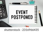 Small photo of Daily planner with the entry Event postponed.