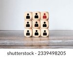 Small photo of Red wooden cube with person icon stand out from the crowd on blue background. Dissenting opinion, divergent views and different concepts